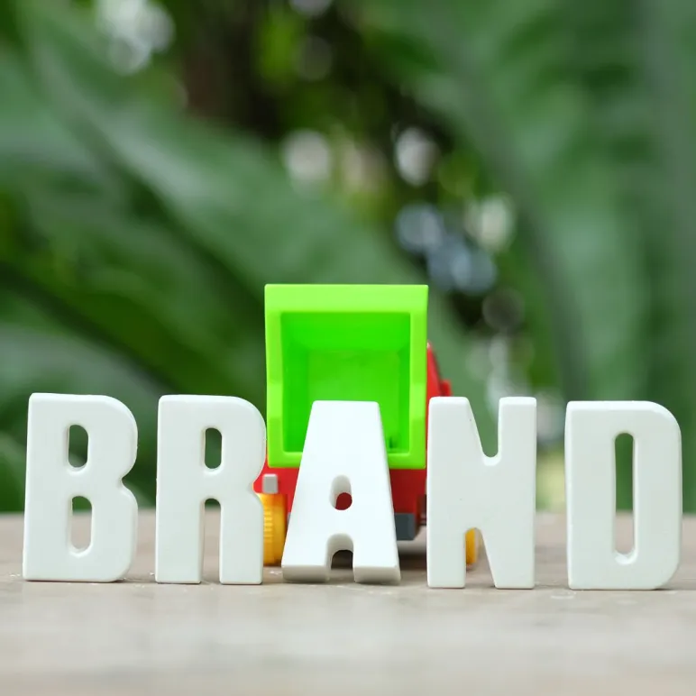 hand arrange white-letters brand